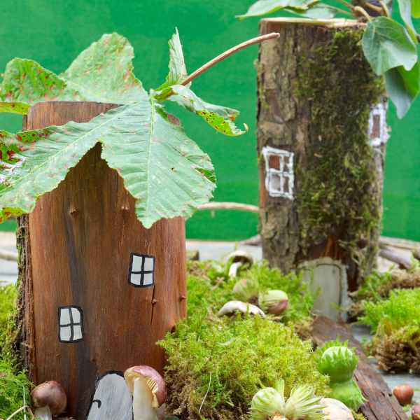 fairy houses made out of tree stumps
